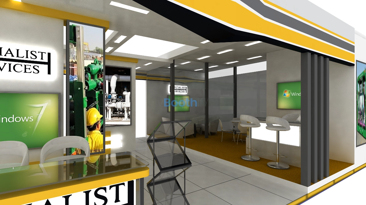 Exhibition stand design with SPECIALIST SERVICES wall text, glass display racks, industrial equipment photos, and seating.